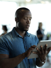 Wall Mural - Technology, business and black man with tablet reading email, sales or social media on web. Research, leadership and company ceo networking with online communication in management at startup office.