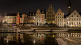 Fototapeta Do akwarium - Cityscape at night and water reflection in Gent, Belgium in January 2023