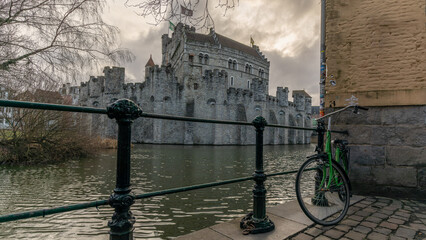 Wall Mural - Bike and medieval castle in Gent, Belgium in January 2023