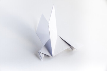 Paper dove origami isolated on a white background