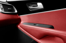 Car Door Handle Inside The Luxury Modern Car With Red Leather Interior. Switch Button Control. Modern Car Interior Details. Red Perforated Leather