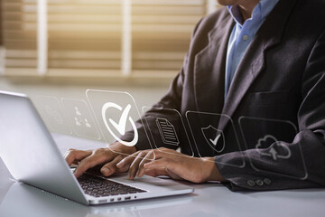 Leinwandbilder - Businessman working on labtop with check mark, document symbol, and standard quality control. The concept of ISO service, international standards and quality assurance is certified.