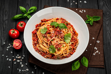 Poster - Traditional italian spaghetti bolognese on a dark background