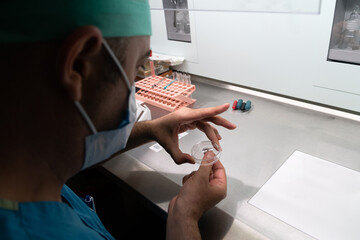 Wall Mural - Embryologist adding labels frozen and ovulated sperm in laboratory of reproductive clinic. in vitro fertilization, egg freezing.