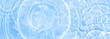© Loraliu - Water panoramic banner background. Water texture, water surface with rings and ripple. Spa concept background. Flat lay, top view, copy space, composition