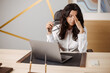 © Ankor_stock. - Stressed and angry young indian or arabic business woman having online meeting at the office by laptop