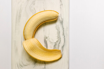 Wall Mural - Cavendish bananas on marble board; top view and copy space.