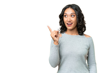 Wall Mural - Young Argentinian woman over isolated background intending to realizes the solution while lifting a finger up