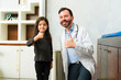 © AntonioDiaz - Positive pediatrician doctor happy with a kid