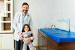 © AntonioDiaz - Cheerful pediatrician with a kid patient