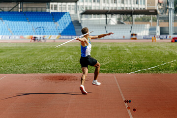 Wall Mural - javelin throw back athlete thrower in track and field event