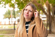 © luismolinero - Young pretty blonde woman at outdoors having doubts