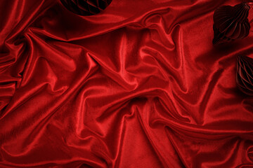dark red velvet textured draped background. beautiful wavy, soft surface of the fabric. christmas an