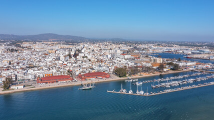 Canvas Print - Aerial view of the Portuguese fishing tourist town of Olhao overlooking the Ria Formosa Marine Park. sea port for yachts and Municipal market