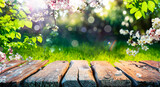 Fototapeta Natura - Spring Time - Blossoms On Wooden Table In Green Garden With Defocused Bokeh Lights And Flare Effect