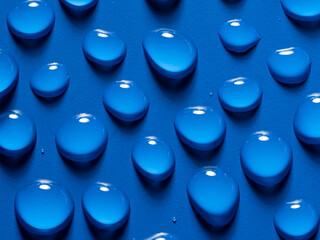 Wall Mural - water drops on a blue background