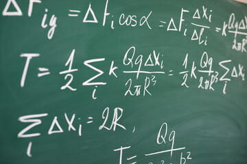 Mathematical formulas written on blackboard