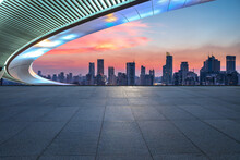 Empty Square Floors And Bridge With City Skyline At Sunset In Shanghai, China.