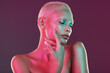 © Nina L/peopleimages.com - Neon, skincare and beauty, woman with hand in face, makeup and light in creative advertising on studio background. Cyberpunk, art girl and fantasy model isolated in futuristic skin care mockup space