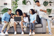 © Allistair F/peopleimages.com - Big family, home and laptop on couch learning with online education, games or movie. Parents, grandparents and children relax together in lounge with internet for quality time streaming and bonding