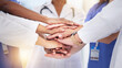 © Mia B/peopleimages.com - Healthcare, diversity and hands of doctors for teamwork, partnership and medicine success. Motivation, support and medical workers in hand gesture for solidarity, help mission and collaboration goals