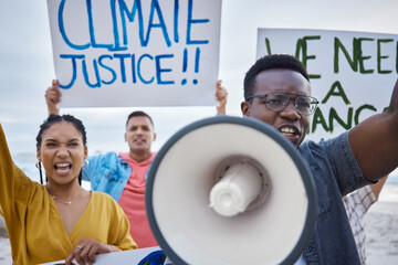 Wall Mural - Climate change sign, protest and black man with megaphone for freedom movement. Angry, crowd screaming and young people by the sea with world support for global, social and equality action at beach