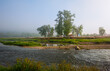 village by the river. rural houses on the coastline. panorama morning view of the village