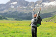 © Antonioguillem - Hiker raising arms celebrating vacation in nature