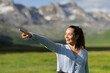 © Antonioguillem - Happy woman pointing in the mountain