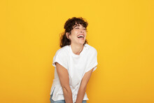 Cheerful Woman With Eyes Closed Against Yellow Background