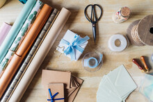 Wrapping Paper With Gifting Material On Desk