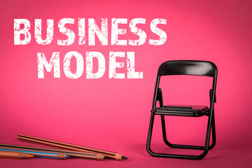Wall Mural - BUSINESS MODEL concept. Miniature chair and pencils on a pink background
