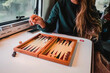 © Cavan Images - Woman playing board game in camper van, Costa Brava, Catalonia, Spain