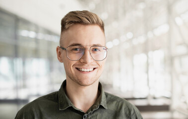 Young handsome man portrait, Cheerful laughing businessman smiling indoor, People, enjoy life, student lifestyle, office life, business concept