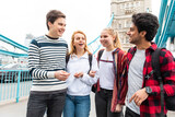 Fototapeta Londyn - Happy students on Tower Bridge in London during school trip