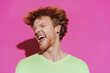 © Drobot Dean - White young redhead man shaking his head and screaming at camera