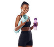 © peopleimages.com - Active woman getting ready for her routine fitness workout holding a yoga mat and a water bottle for her routine excercise isolated on a png background.
