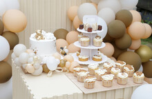 Creative Gender Neutral Baby Shower Or Birthday Decoration In The Garden. Bohemian Style Outdoor Event Set Up With Balloons. White Cream Peach Caramel Balloon Arch Kit. Sweet Table For A Party
