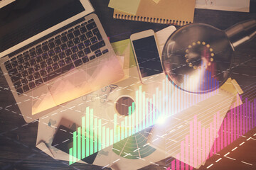 Poster - Financial market graph and top view computer on the desktop background. Multi exposure. Investment concept.