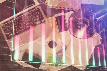 Poster - Financial market graph and top view computer on the desktop background. Multi exposure. Investment concept.