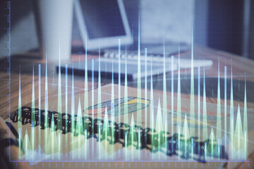 Poster - Double exposure of financial graph drawings and desk with open notebook background. Concept of forex market