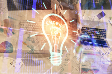 Poster - Double exposure of man and woman working together and light bulb hologram drawing. Idea concept. Computer background.