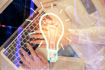 Poster - Double exposure of woman hands working on computer and light bulb hologram drawing. Top View. Idea concept.