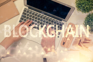 Poster - Double exposure of woman hands working on computer and blockchain theme hologram drawing. Top View. bitcoin cryptocurrency concept.