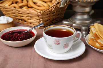 Wall Mural - Aromatic tea and cherry jam on table