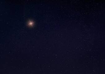 Wall Mural - Bright light in the sky on a starry night