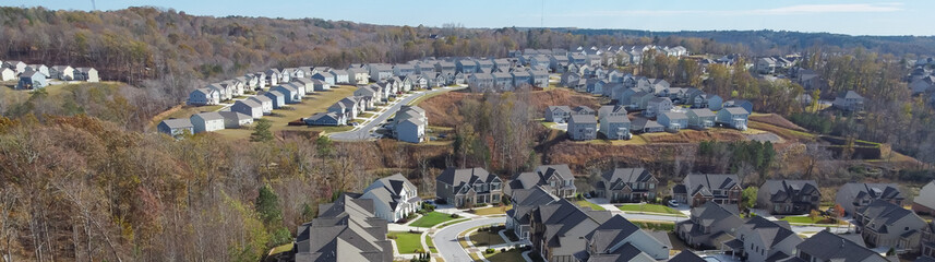 Wall Mural - Panorama view row of new developments houses in master planned subdivision with lush green trees and natural trails outside Atlanta, Georgia, US