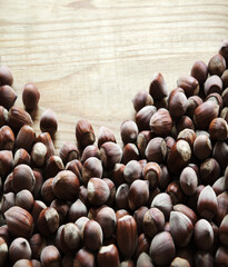 Wall Mural - Hazelnuts on a wooden table