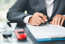 Car Dealer Business Woman Signing Car Insurance Document Or Lease Paper. Planning To Manage Transportation Finance Costs. Concept Of Car Insurance Business, Saving Buy With Tax And Loan For New Car.