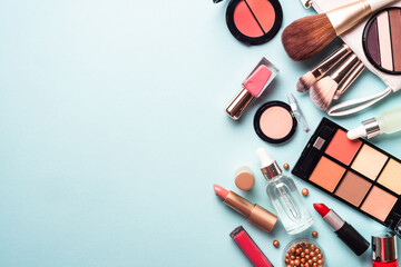Wall Mural - Make up cosmetics on blue background. Flat lay with copy space.